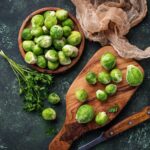 Brussels sprouts on green concrete background